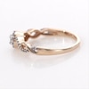 0.23 CT. T.W. Diamond Frame Twist Ring in 10K Rose Gold