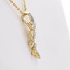 0.04 CT. T.W. Diamond Curved Leaf Vine Pendant in 10K Gold