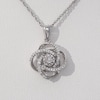 0.115 CT. T.W. Diamond Love Knot Pendant in Sterling Silver