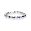 Oval Lab-Created Blue Sapphire and 0.23 CT. T.W. Diamond Double Infinity Bracelet in Sterling Silver - 7.25"