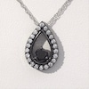 0.95 CT. T.W. Enhanced Black and White Diamond Teardrop Frame Pendant in 10K White Gold with Black Rhodium