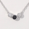 0.23 CT. T.W. Enhanced Black and White Diamond Three Stone Bezel-Set Necklace in 10K White Gold