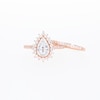 0.95 CT. T.W. Pear-Shaped Multi-Diamond Flower Frame Bridal Set in 10K Rose Gold (J/I3)