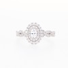 Vera Wang Love Collection Canadian Certified Oval Centre Diamond 0.69 CT. T.W. Twist Engagement Ring in 14K White Gold