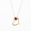 Lab-Created Ruby and 0.04 CT. T.W. Diamond Tilted Heart Pendant in 10K Gold